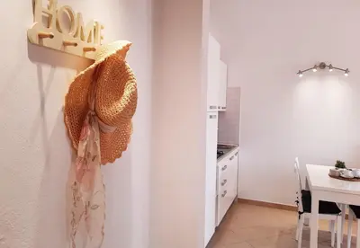 a kitchen with a table and a dining room at Sunshine home Sal in Santa Maria