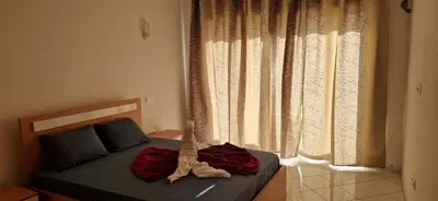 a bedroom with a bed with a dinosaur on it at PIMONTAPARTMENTS in Espargos