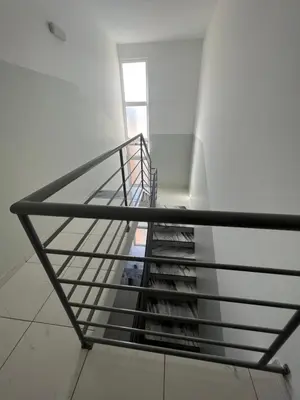 a staircase with a metal railing in a building at PIMONTAPARTMENTS in Espargos