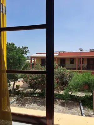 a view of a building from a window at Bamboo Xaguate Hotel in São Filipe
