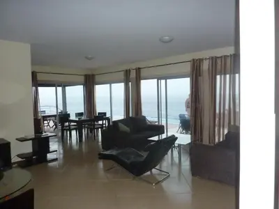 a living room with a view of the ocean at Villa Halcyon cabo verde close to the beach in Cidade Velha