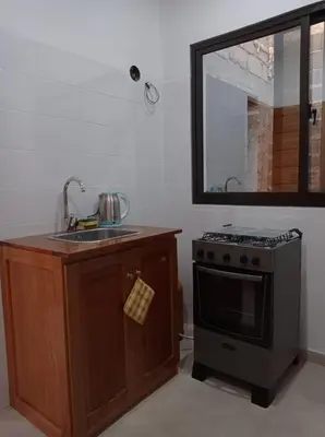 a kitchen with a sink and a stove at Apartamento Avenida in Sal Rei