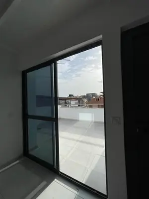 a window in a room with a view of a balcony at Apartamento in Praia