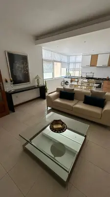 a living room with a couch and a table at Residence Fazenda - Piscina in Praia