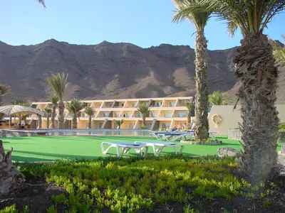 a resort with palm trees and a tennis court at Foya Branca by Flagworld Hotels in São Pedro