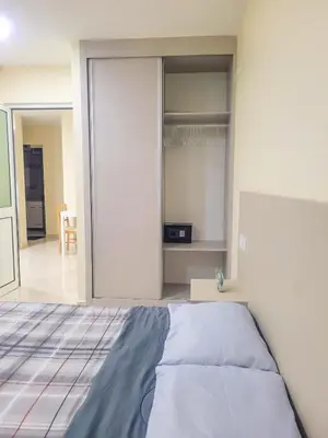 a bedroom with a bed and a sliding glass door at Castelinho Sal Lodge in Espargos