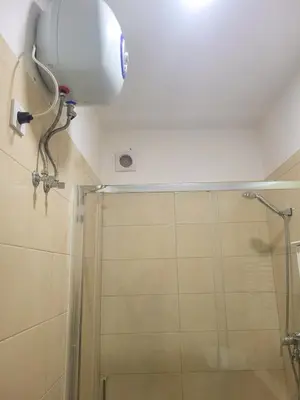 a shower in a bathroom with a shower head at Castelinho Sal Lodge in Espargos