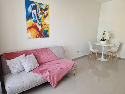 a living room with a couch and a table at Apartamentos Beira-Mar in Mindelo