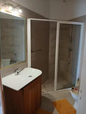 a bathroom with a shower and a sink and a toilet at Beach Villa am Praia de Chaves, Boa Vista, Cabo Verde in Boa Ventura