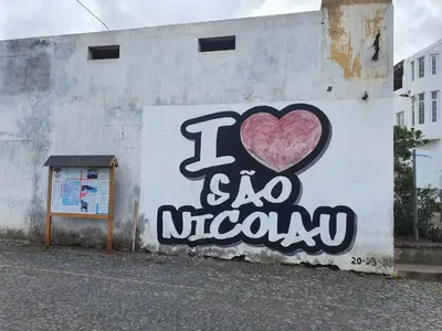 a wall with a heart painted on it at Seaview Apartment in Tarrafal