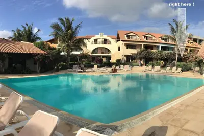 a large swimming pool in front of a resort at Porto Antigo 2 Beach Club in Santa Maria