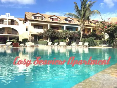a swimming pool in front of a resort at Porto Antigo 2 Beach Club in Santa Maria