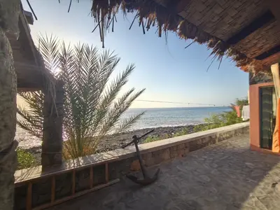 a view of the beach from a beach house at Casa Praia Tarrafal de Monte Trigo in Seladinha