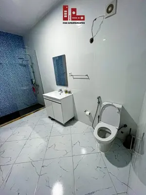 a bathroom with a toilet and a sink at Figo Apartamento Sol & Brisa Cidadela T2 in Praia
