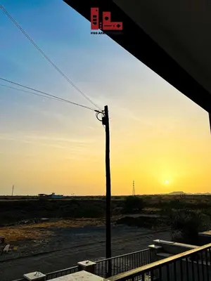 a telephone pole with the sunset in the background at Figo Apartamento Sol & Brisa Cidadela T2 in Praia
