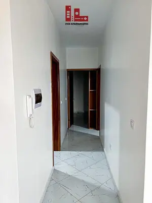 an empty room with a hallway with a phone on the wall at Figo Apartamento Sol & Brisa Cidadela T2 in Praia