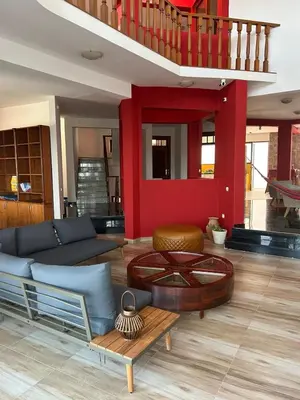 a living room with a couch and a table at Villa PalMarina in Praia