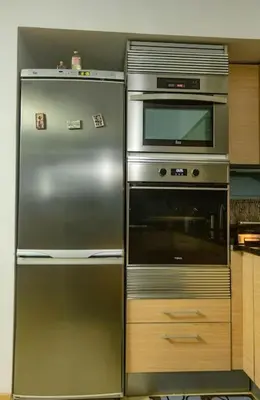 a stainless steel refrigerator and microwave in a kitchen at Sol & Lar No stress in Santa Maria