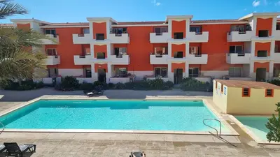 a swimming pool in front of a building at Isla de Sal in Santa Maria
