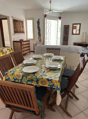 a dining room table with a floral table cloth on it at KatlantiK Estoril Deluxe in Sal Rei