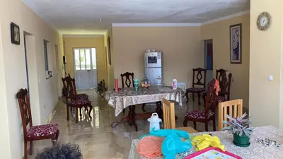 a kitchen with a table and chairs in a room at Casa Adriano & Filomena Montrond in Portela