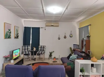 a living room with purple couches and a tv at Mendes Family Homestay - B&B In The Heart Of Praia in Praia