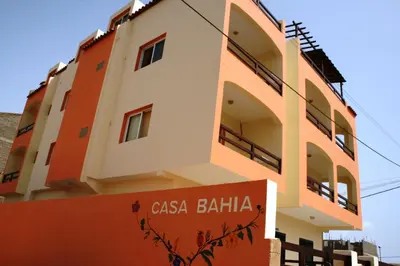 a building with a sign in front of it at Casa Bahia 10 Grande Penthouse in Santa Maria