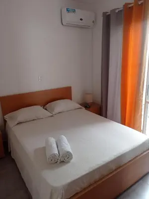 a bedroom with a bed with two towels on it at Tity Apartments T2- Santa Maria in Santa Maria