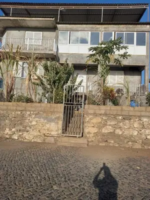 a shadow of a person standing in front of a building at Casa Graciosa in Tarrafal