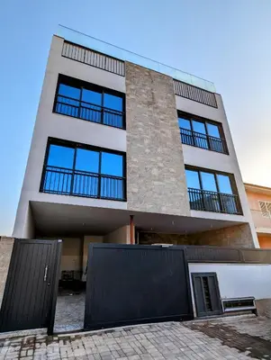 a tall building with blue windows on it at Tarrafal Bay - 1Bdr Apt - Sea view -1 in Tarrafal