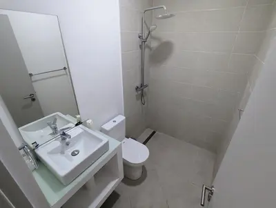 a bathroom with a sink and a toilet and a mirror at Tarrafal Bay - 1Bdr Apt - Sea view - 2 in Tarrafal