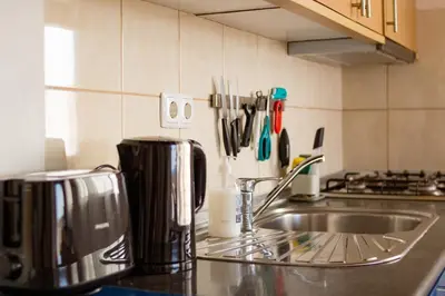 a kitchen counter top with a sink and a counter top at Calma de Sal Santana Ocean View Apartment in Santa Maria