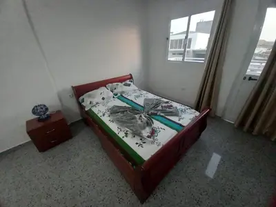 a small bed in a room with a window at Casa Herminia in Tarrafal