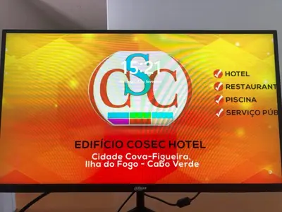 a television screen with a sign for a hotel at COSEC Tours in Cova Figueira