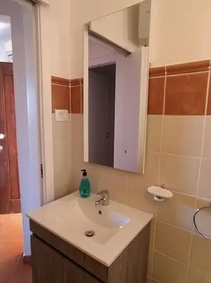 a bathroom with a sink and a mirror at Apartament in Porto Antigo 2 - Santa Maria in Santa Maria