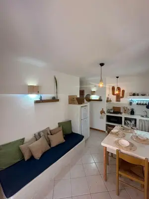 a living room with a couch and a table at Boutique Apartments Ibiscus in Santa Maria