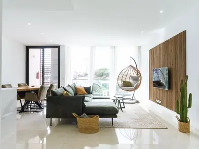 a living room with a couch and a table at Filomena Apartments ORIENTAL in Mindelo