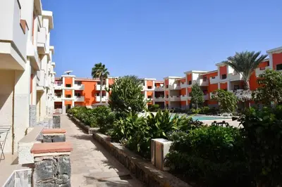 a view of a resort with a pool and buildings at Kyaala Djadsal Moradias pool&sea in Santa Maria