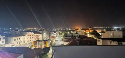 a view of a city at night with lights at ACG Plato Vacation Apartment with Balcony in Praia