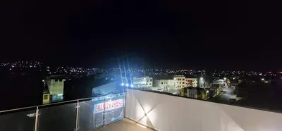 a view of a city at night with lights at ACG Plato Vacation Apartment with Balcony in Praia