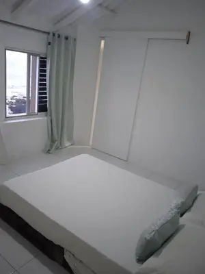 a white bed in a room with a window at L2B - São Vicente in Mindelo