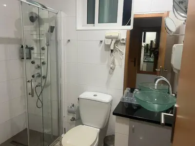 a bathroom with a toilet and a sink and a shower at Djeu View in Praia