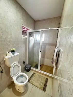 a bathroom with a shower and a toilet in it at Cozy Home with Terrace Views! in Ponta do Sol