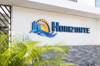 a sign on the side of a building at Lux 3-BR: Panoramic Sea View & Rooftop Pool in Praia