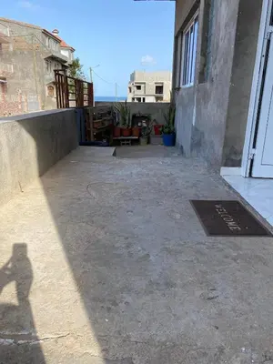 a shadow of a person on a patio at Casa dos Amigos in Calheta de São Miguel