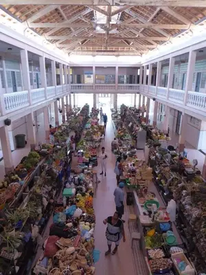 a large room filled with tables filled with people at Flat City Center Mindelo in Mindelo