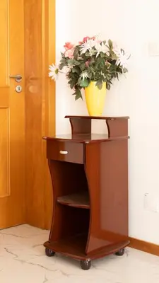 a plant in a yellow vase on top of a table at 2 bdr apt in Palmarejo Baixo, near seafront - LCGR in Praia