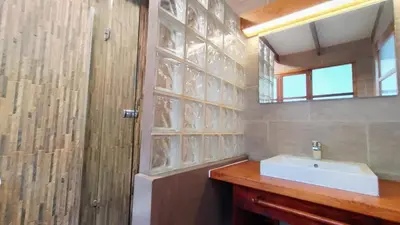 a bathroom with a white sink and a mirror at Casa Cavoquinho in Paul