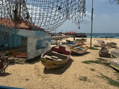 a group of boats sitting on the beach at SMR AP08 in Santa Maria