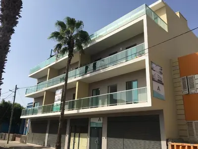 a building with a palm tree in front of it at SMR AP08 in Santa Maria